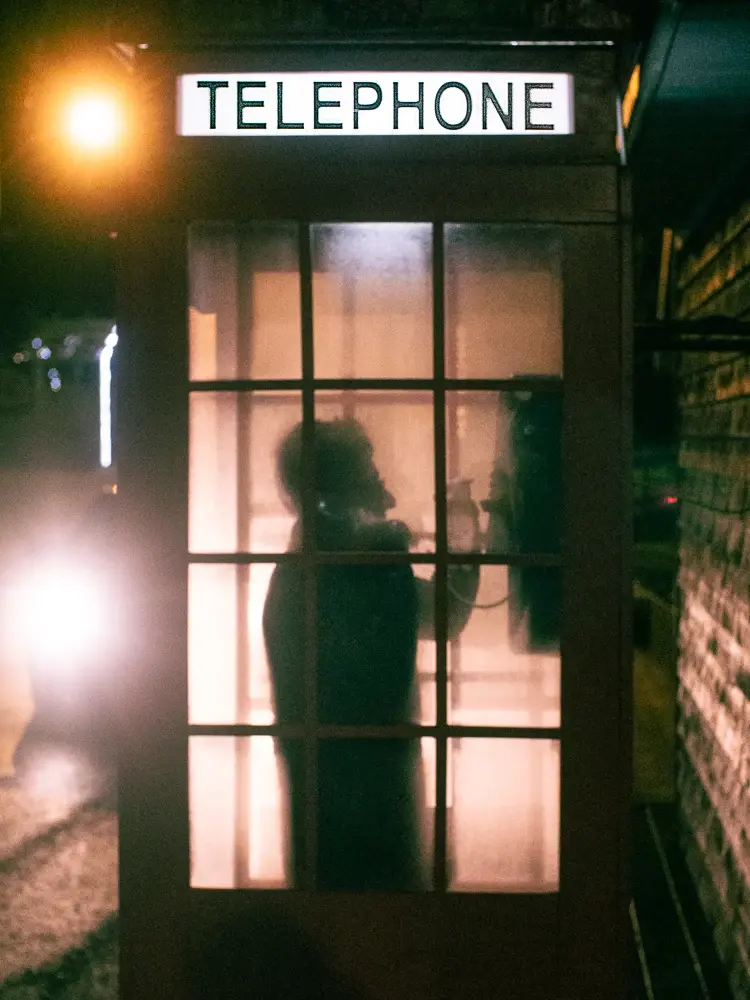 Sharif in an old telephone booth